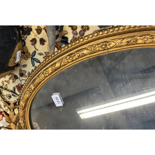 265 - 20TH CENTURY GILT FRAMED OVAL MIRROR, HEIGHT 86CM