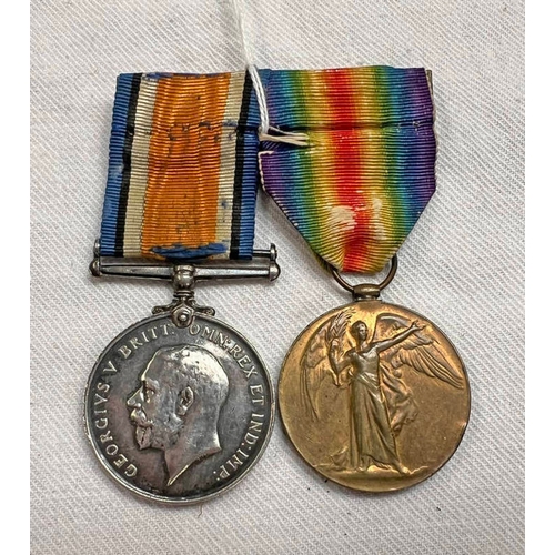 1129 - WW1 PAIR OF MEDALS TO PRIVATE E J RUST OF THE 4TH SOUTH AFRICAN INFANTRY (PTE. E J RUST 4TH S.A.I)