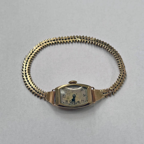 217 - 9CT GOLD LADIES WRISTWATCH ON A WISHBONE LINK BRACELET - UNMARKED , 17 CM LONG, 13.7 G