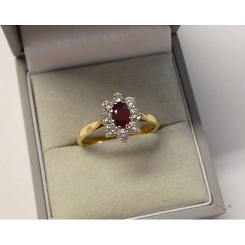 235 - 18CT GOLD RUBY & DIAMOND CLUSTER RING, THE OVAL RUBY SET WITHIN A SURROUND OF BRILLIANT CUT DIAMONDS... 