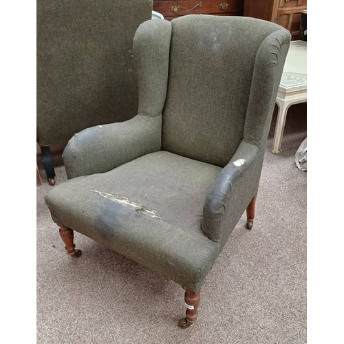 5010 - 19TH CENTURY OVERSTUFFED WINGBACK ARMCHAIR ON TURNED SUPPORTS