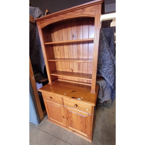 5064 - PINE BOOKCASE WITH OPEN SHELVES OVER BASE OF 2 DRAWERS OVER 2 PANEL DOORS