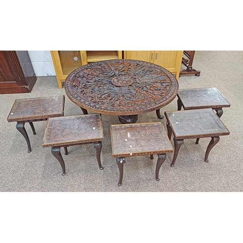 5146 - AFRICAN HARDWOOD CIRCULAR TABLE WITH CARVED ETHNIC HUNTING SCENE DECORATION ON SHAPED SUPPORTS & 5 M... 