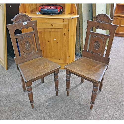 5220 - PAIR OF LATE 19TH CENTURY OAK HALL CHAIRS WITH CARVED DECORATION ON TURNED SUPPORTS