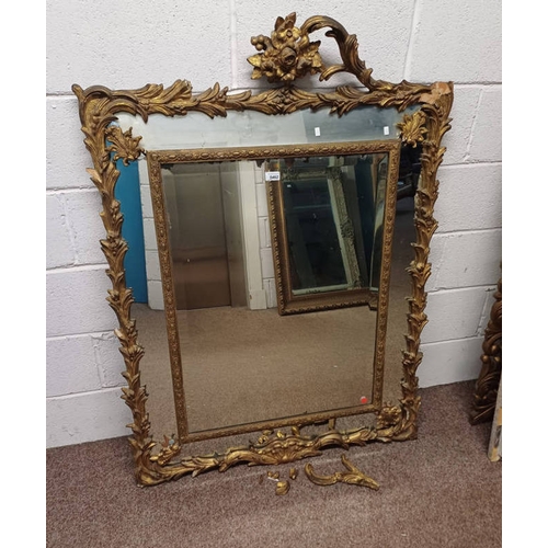 5462 - LARGE DECORATIVE GILT FRAMED RECTANGULAR MIRROR SURMOUNTED BY FLORAL DECORATION. GLASS DIMENSIONS; 6... 