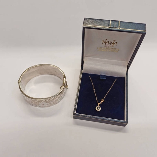 664 - SILVER FLORAL ENGRAVED HINGED BANGLE - 42 G & 9CT GOLD SAPPHIRE & DIAMOND PENDANT ON CHAIN - 1.0 G