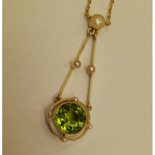 111 - EARLY 20TH CENTURY 15CT GOLD PEARL & PERIDOT NEGLIGEE PENDANT. THE CIRCULAR PERIDOT SET BETWEEN 4 SE... 