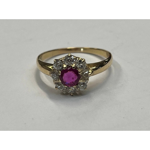 260 - RUBY & DIAMOND CLUSTER RING, THE CIRCULAR CUT RUBY SET WITHIN A SURROUND OF 8 DIAMONDS APPROX 0.6 CA... 