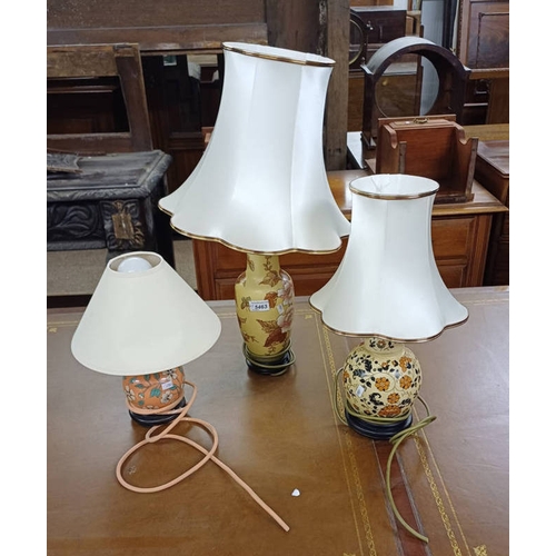 1472 - 3 PORCELAIN TABLE LAMPS WITH FLORAL DECORATION AND HARDWOOD BASES.