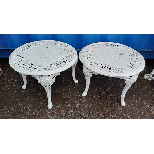 278 - PAIR OF PAINTED CAST METAL CIRCULAR GARDEN TABLE ON FLORAL SHAPED SUPPORTS