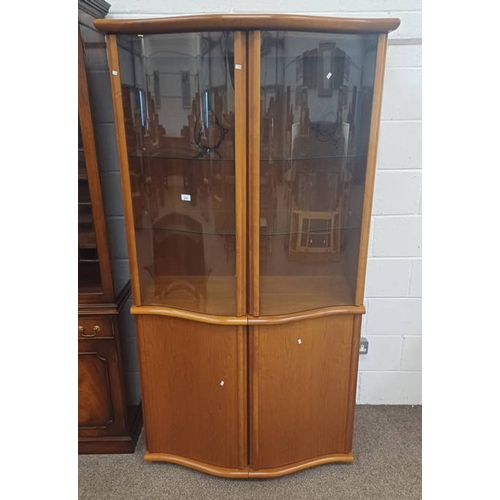 291 - SKOVBY TEAK DISPLAY CABINET WITH SHAPED FRONT & 2 GLAZED PANEL DOORS OVER 2 PANEL DOORS. 192 CM TALL