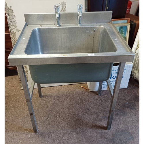 329 - STAINLESS STEEL SINK WITH TAPS.  OVERALL DIMENSIONS 92CM TALL X 76 CM WIDE