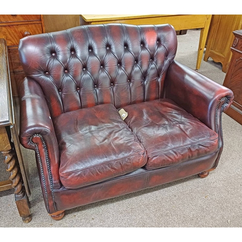 422 - BUTTONED BACK OXBLOOD 2 SEATER SETTEE BY THOMAS LLOYD