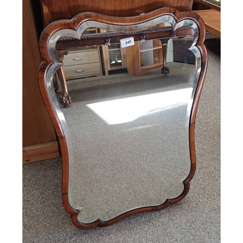 440 - SHAPED MAHOGANY FRAMED MIRROR WITH BEVELLED EDGE.  TOTAL DIMENSIONS  79 CM X 53 CM