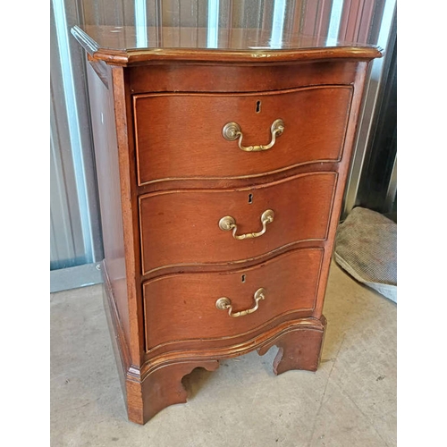 94 - MAHOGANY BEDSIDE CHEST WITH SHAPED FRONT & 3 DRAWERS ON BRACKET SUPPORTS.  79 CM TALL X 52 CM WIDE