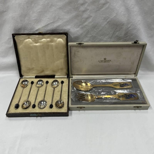 28 - CASED PAIR DANISH SILVER-GILT NATIVITY FORK & SPOON SET BY A MICHELSEN & CASED SET IF 6 SILVER COFFE... 