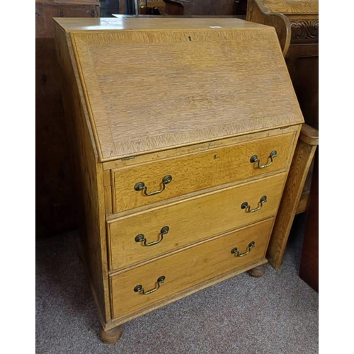 5018 - EARLY 20TH CENTURY OAK BUREAU WITH FALL FRONT OVER 3 DRAWERS LABELLED 'WARING & GILLOW, 1932, LTD' T... 