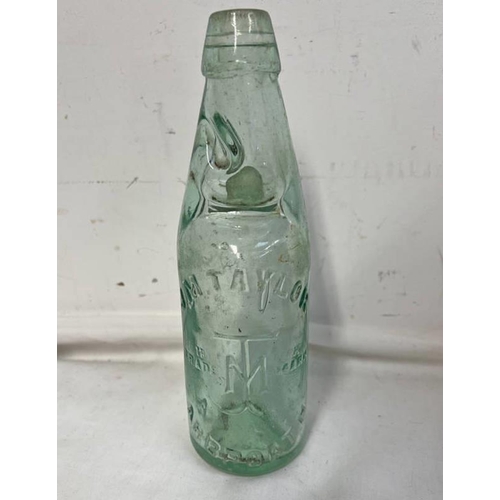 1004 - J M TAYLOR ARBROATH GLASS COD BOTTLE, CANNINGTON SHAW & CO, MAKERS ST HELENS, 22CM TALL