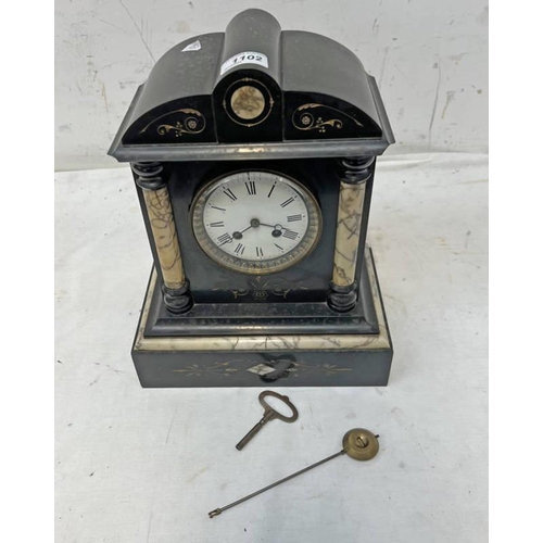 1102 - LATE 19TH OR EARLY 20TH CENTURY SLATE MANTLE CLOCK WITH WHITE ENAMEL DIAL WITH ROMAN NUMERALS