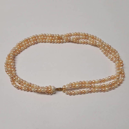 43 - PINK CULTURED PEARL TRIPLE STRAND NECKLACE ON A 9CT GOLD CLASP - 46CM LONG