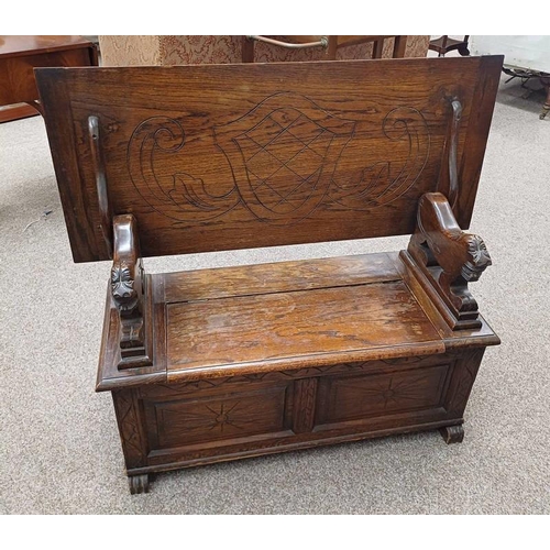 5064 - EARLY 20TH CENTURY CARVED OAK MONK'S BENCH WITH LION HANDLES & LIFT LID SEAT - 107 CM WIDE