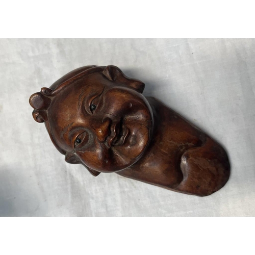 1112 - TWO CARVED WOODEN ORIENTAL FIGURES ON STANDS ALONG WTIH A CIRCULAR CAST METAL ORIENTAL PLAQUE ON STA... 