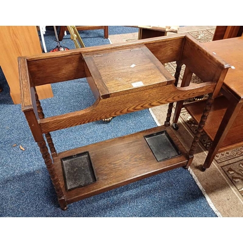 189 - EARLY 20TH CENTURY OAK STICK STAND WITH LIFT - UP LID TOP ON BOBBIN SUPPORTS.  74 CM TALL X 77 CM LO... 