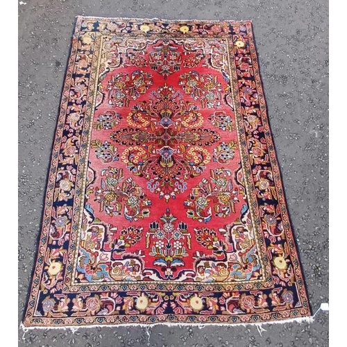 2324 - RED GROUND PERSIAN VILLAGE RUG WITH MULTICOLOURED FLORAL DESIGN, 206 X 141CM