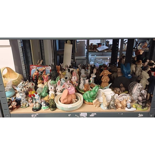 3255A - SELECTION OF VARIOUS PORCELAIN RABBITS OVER ONE SHELF