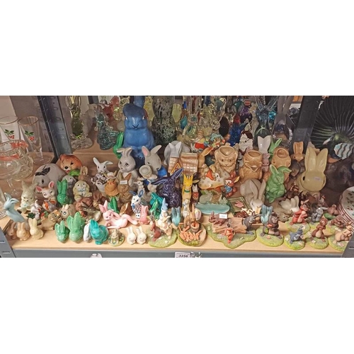 3256 - SELECTION OF VARIOUS PORCELAIN RABBITS OVER ONE SHELF