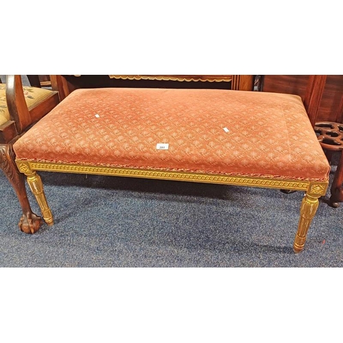 391 - 19TH CENTURY GILT FRAMED RECTANGULAR STOOL ON REEDED SUPPORTS - 103 CM LONG