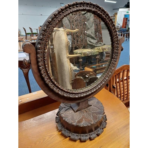 435 - LATE 19TH CENTURY CARVED OAK CIRCULAR DRESSING TABLE MIRROR ON CIRCULAR BASE. TOTAL HEIGHT 74 CM