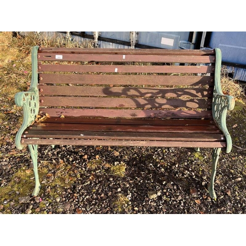 482 - WOODEN GARDEN BENCH WITH DECORATIVE CAST METAL ENDS