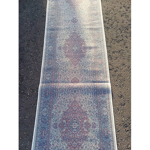 2063 - LARGE IVORY GROUND CASHMERE RUNNER WITH FULL PILE AND A TRADITIONAL MEDALLION DESIGN 502CM X 77CM