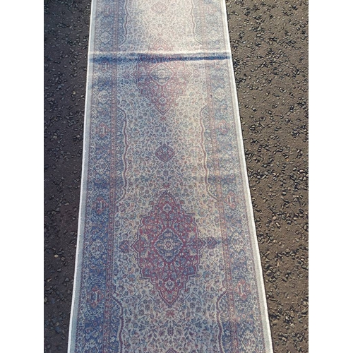 2063 - LARGE IVORY GROUND CASHMERE RUNNER WITH FULL PILE AND A TRADITIONAL MEDALLION DESIGN 502CM X 77CM