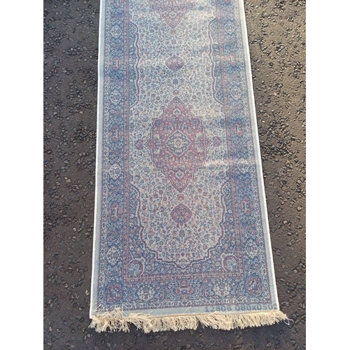 2063 - LARGE IVORY GROUND CASHMERE RUNNER WITH FULL PILE AND A TRADITIONAL MEDALLION DESIGN 502CM X 77CM