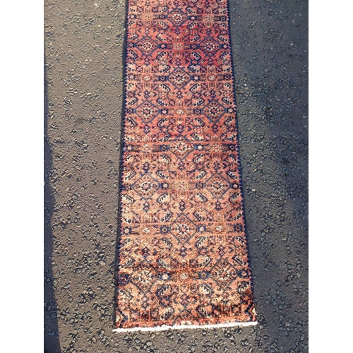 2076 - WASHED RED GROUND PERSIAN SUROK RUNNER WITH ALL OVER DESIGN 315CM X 58CM