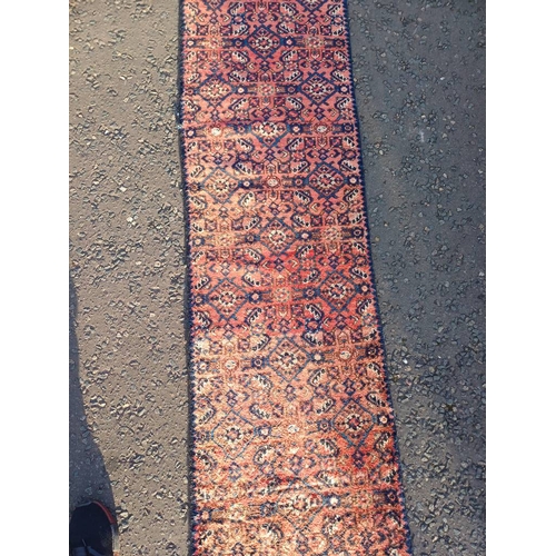 2076 - WASHED RED GROUND PERSIAN SUROK RUNNER WITH ALL OVER DESIGN 315CM X 58CM