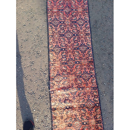 2076 - WASHED RED GROUND PERSIAN SUROK RUNNER WITH ALL OVER DESIGN 315CM X 58CM