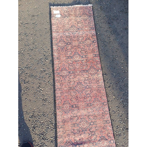 2076 - WASHED RED GROUND PERSIAN SUROK RUNNER WITH ALL OVER DESIGN 315CM X 58CM