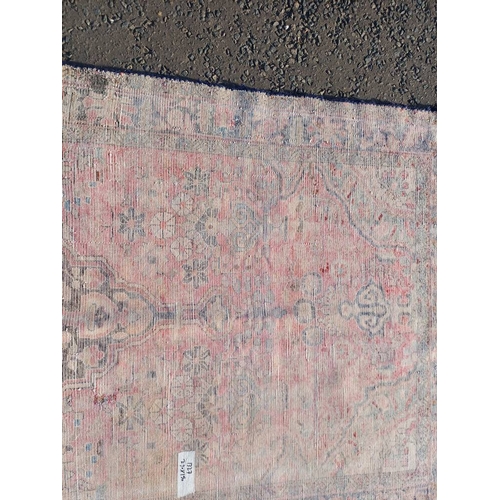 2112 - RED GROUND PERSIAN RUG WITH ALL OVER DESIGN 286 X 149CM