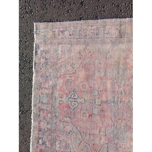 2112 - RED GROUND PERSIAN RUG WITH ALL OVER DESIGN 286 X 149CM