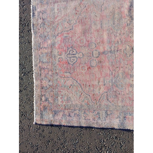 2112 - RED GROUND PERSIAN RUG WITH ALL OVER DESIGN 286 X 149CM