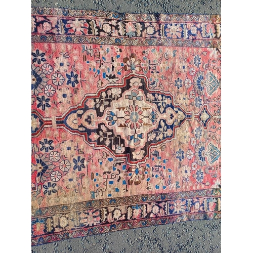 2112 - RED GROUND PERSIAN RUG WITH ALL OVER DESIGN 286 X 149CM