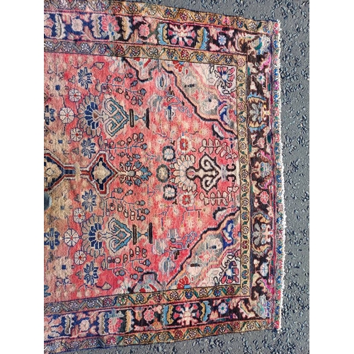 2112 - RED GROUND PERSIAN RUG WITH ALL OVER DESIGN 286 X 149CM