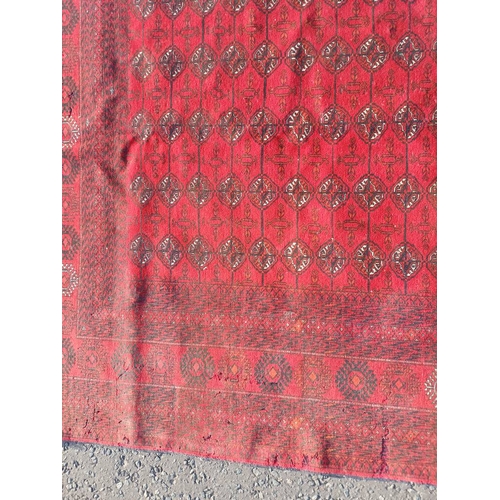 2118 - FINE HAND WOVEN RICH RED GROUND TURKMAN CARPET WITH ALL OVER BAKARA DESIGN 294CM X 191CM