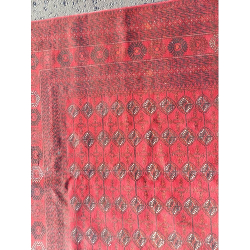 2118 - FINE HAND WOVEN RICH RED GROUND TURKMAN CARPET WITH ALL OVER BAKARA DESIGN 294CM X 191CM