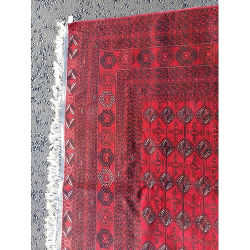 2118 - FINE HAND WOVEN RICH RED GROUND TURKMAN CARPET WITH ALL OVER BAKARA DESIGN 294CM X 191CM