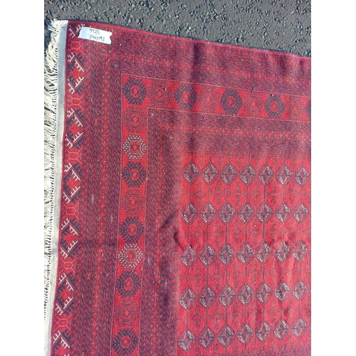 2118 - FINE HAND WOVEN RICH RED GROUND TURKMAN CARPET WITH ALL OVER BAKARA DESIGN 294CM X 191CM