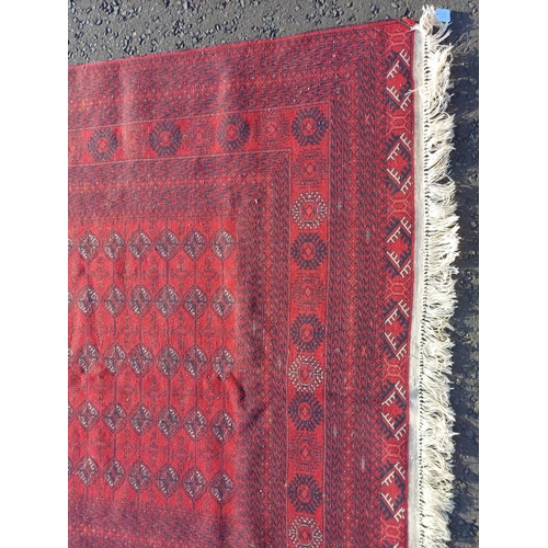 2118 - FINE HAND WOVEN RICH RED GROUND TURKMAN CARPET WITH ALL OVER BAKARA DESIGN 294CM X 191CM